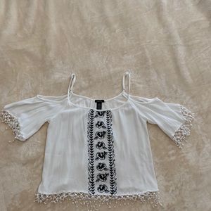 I am selling an adorable black and while blouse!